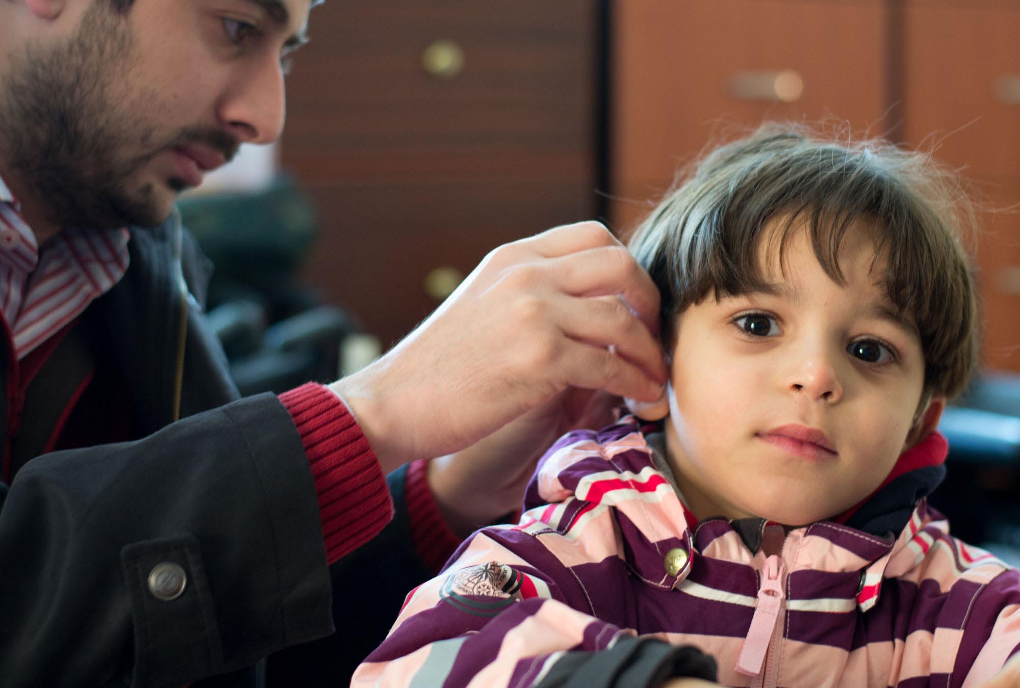 Ali has his new hearing aids fine tuned to allow him to hear the world around him for first time.