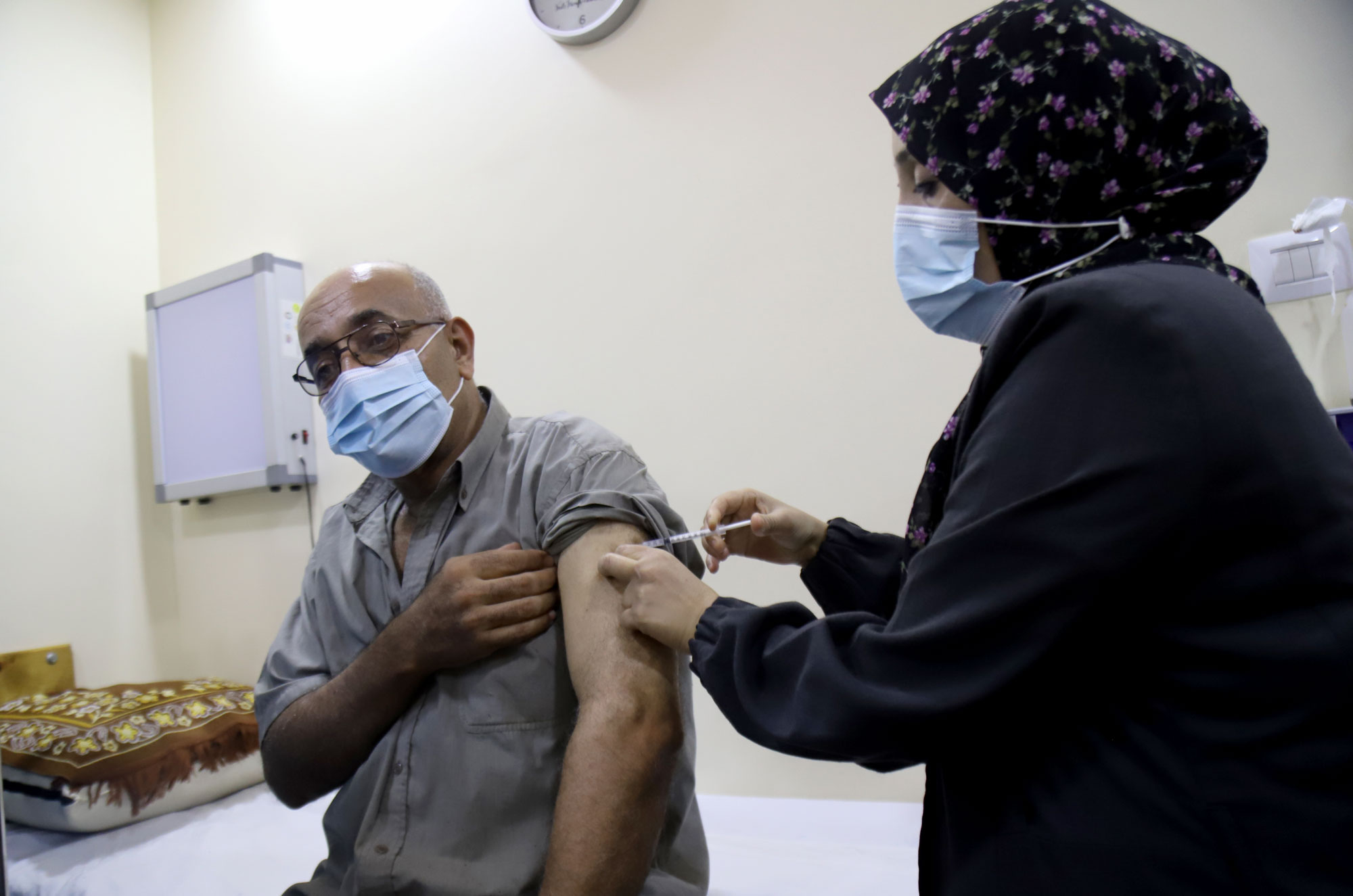 Khamis receiving an injection at the clinic.