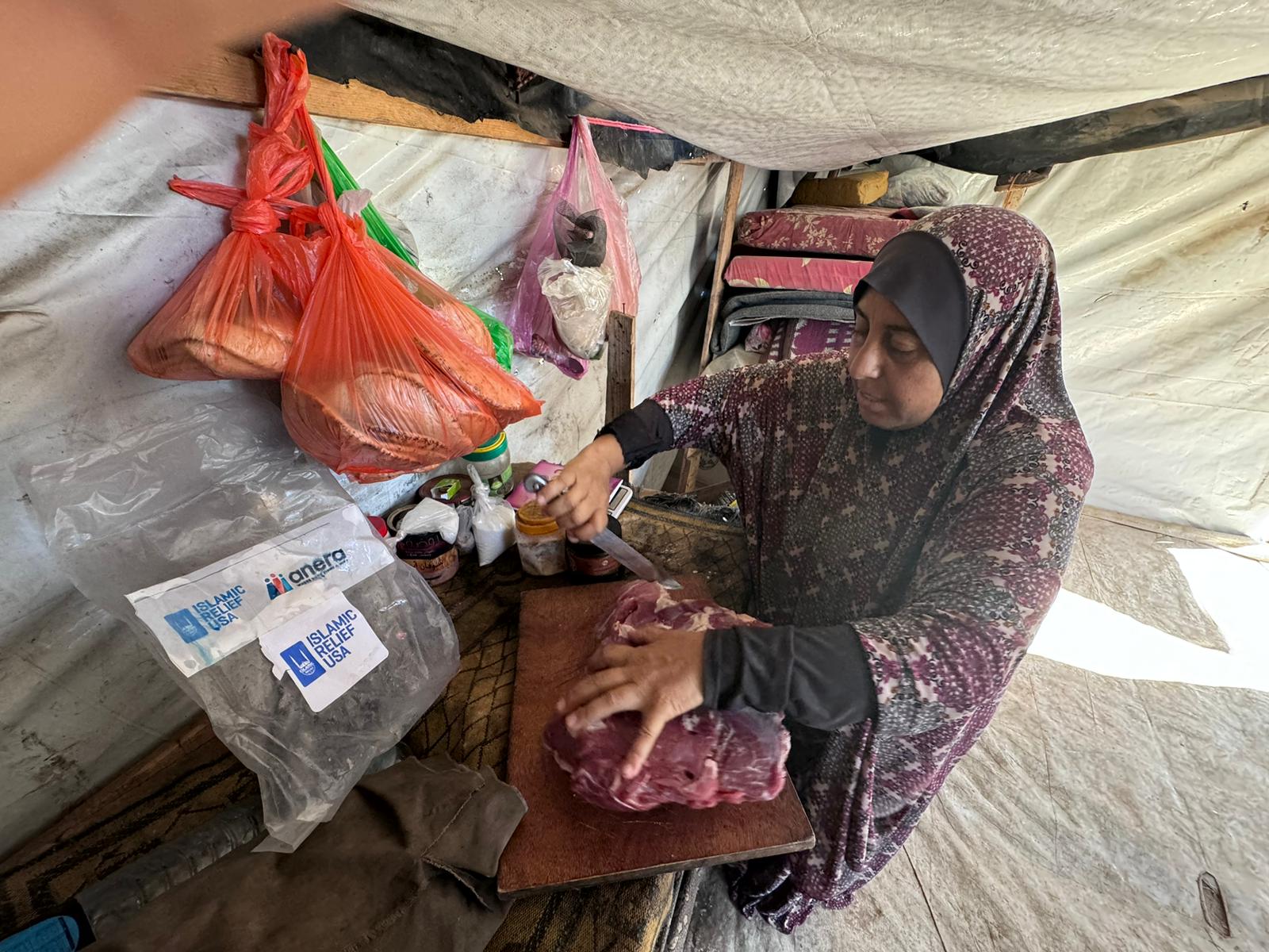 Nabila preparing the Qurbani meat to make mlokheyeh, a traditional dish made from leafy greens, usually served with rice and meat.