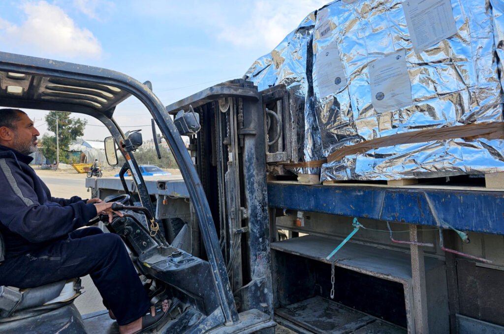 Unloading relief supplies in Gaza.